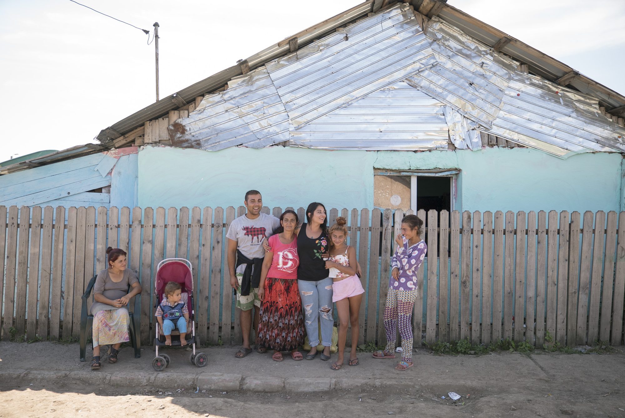 Jessi Froud with her birth family outside their house in Călărași